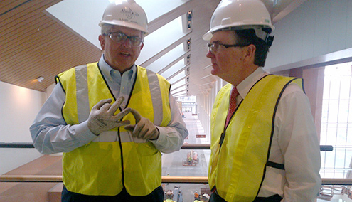Dennis Lockhart, president of the Federal Reserve Bank of Atlanta (right), and Larry Atema of the Nashville Convention Center Authority toured the Music City Center while it was under construction.