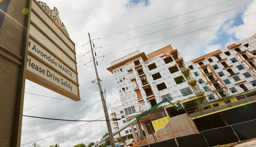 housing development under construction with a sign for the Avondale MARTA station in the foreground